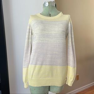 Soft yellow watercolor cotton top with mother of Pearl buttons on sides!